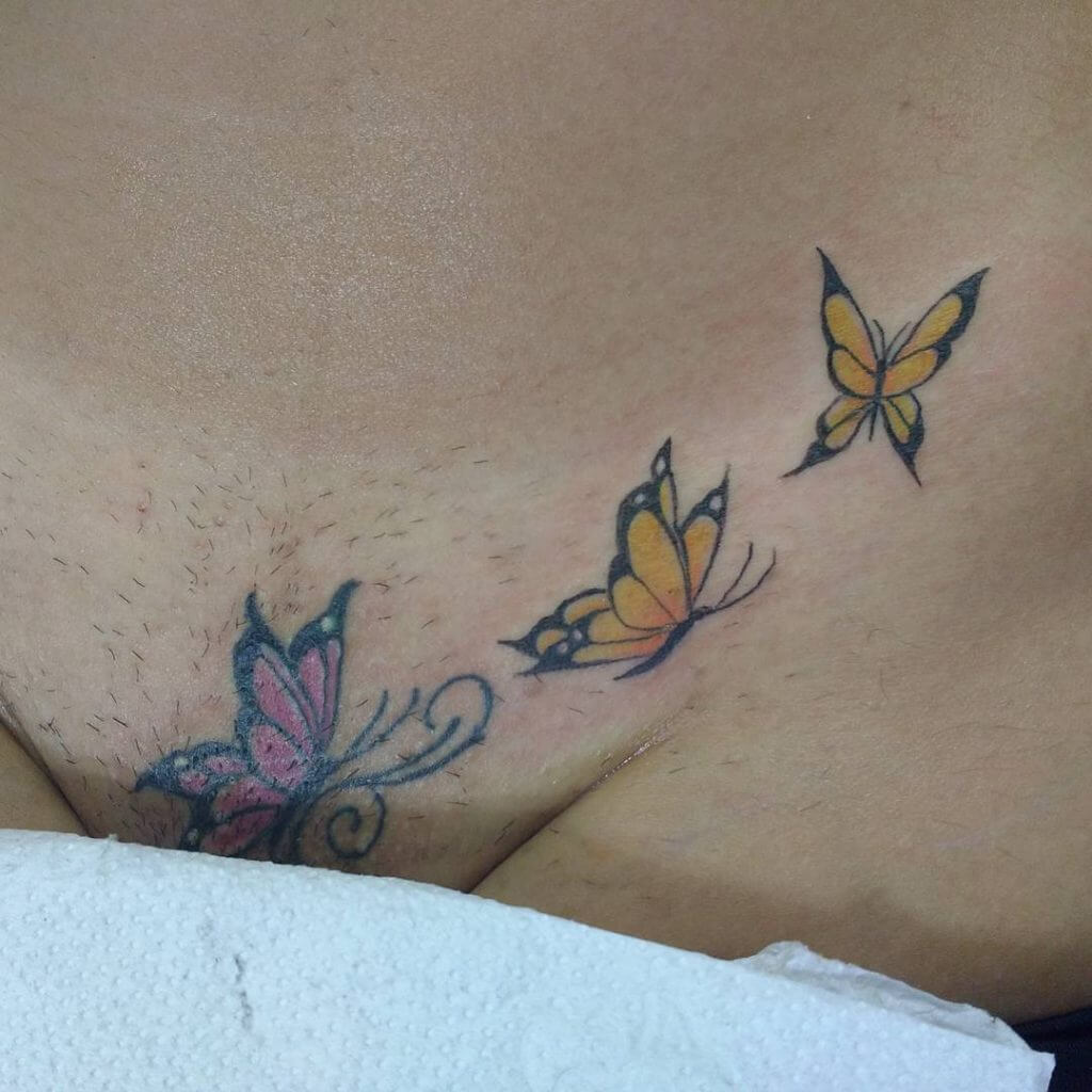 Intimate Color tattoos of butterfly in the pubic zone