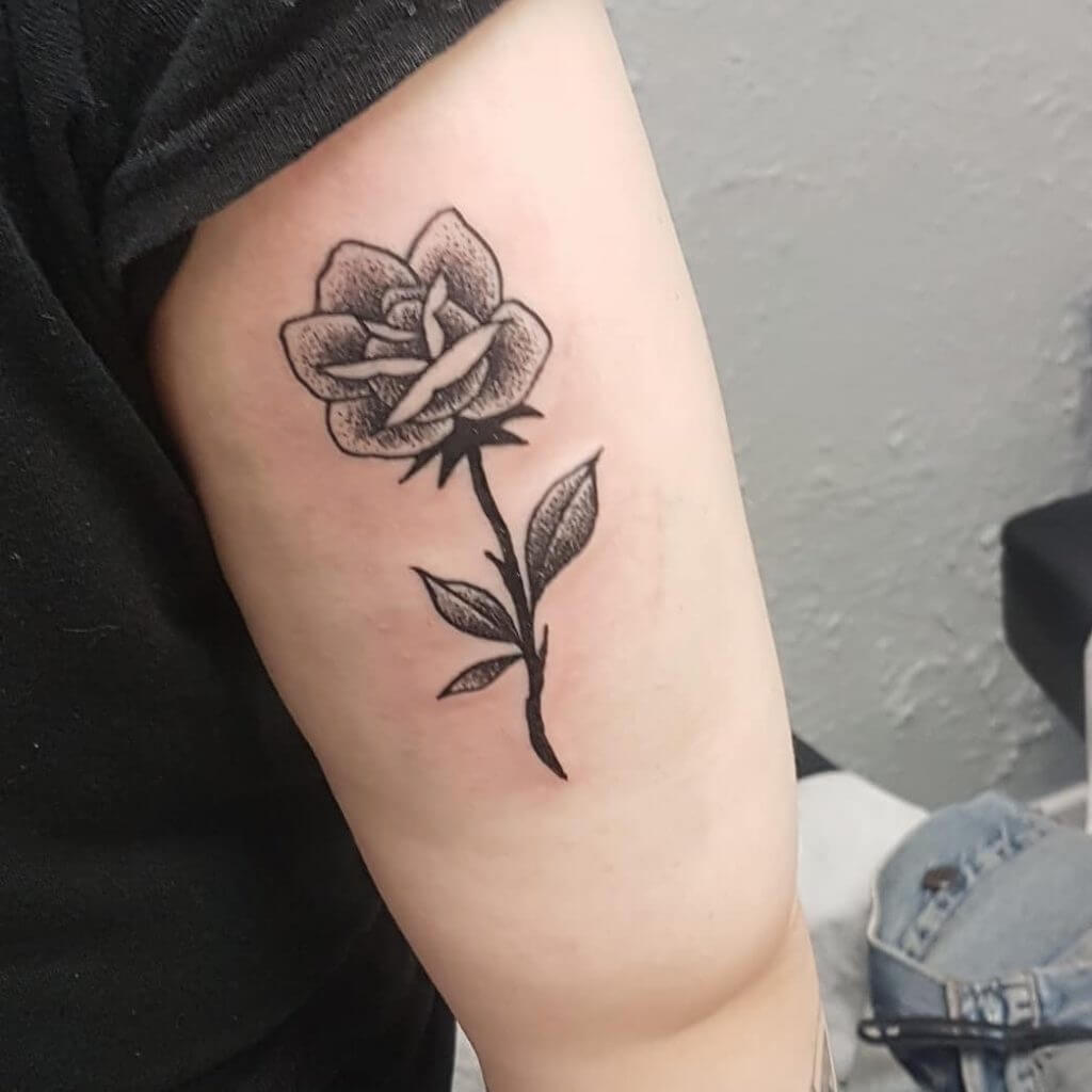 Dot work rose tattoo on the right hand