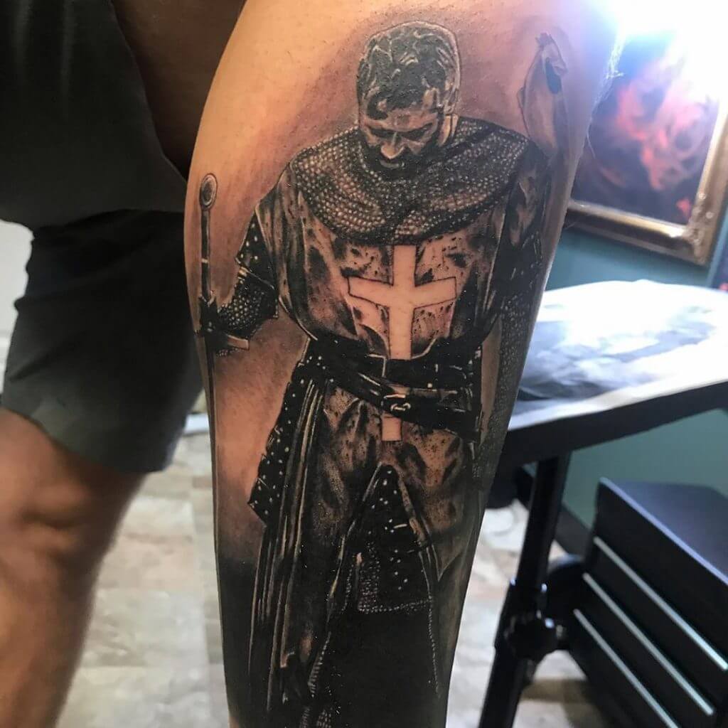 Black and Gray Tattoo of a male Warrior on the calf