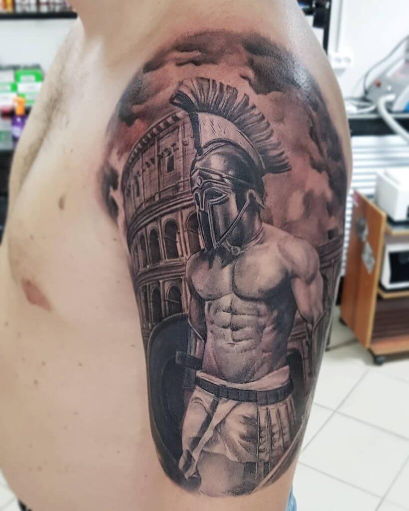 Black and Gray Tattoo of a male Warrior on the left shoulder