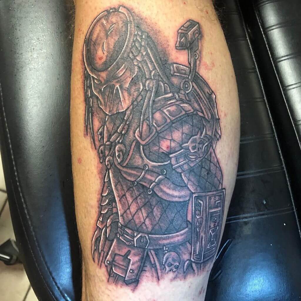 Black and Gray Male tattoo of Predator on the calf