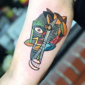 Abstract tattoo on the left forearm