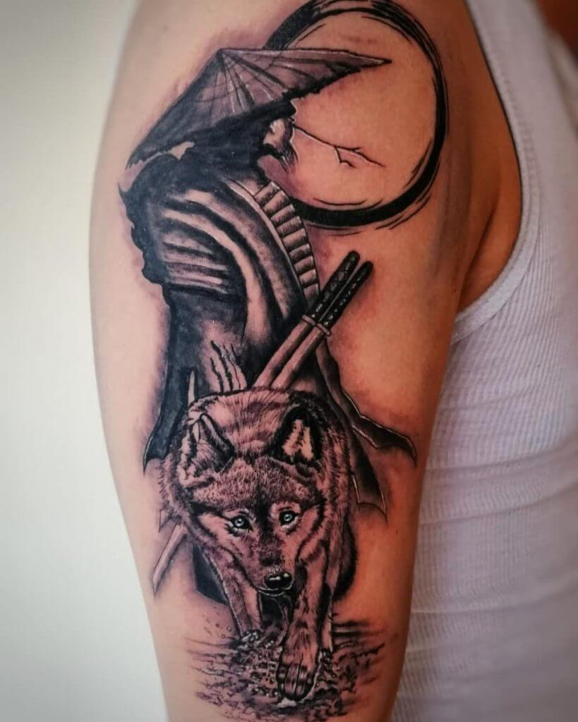 Black Tattoo of a male Warrior with a wolf on the right shoulder