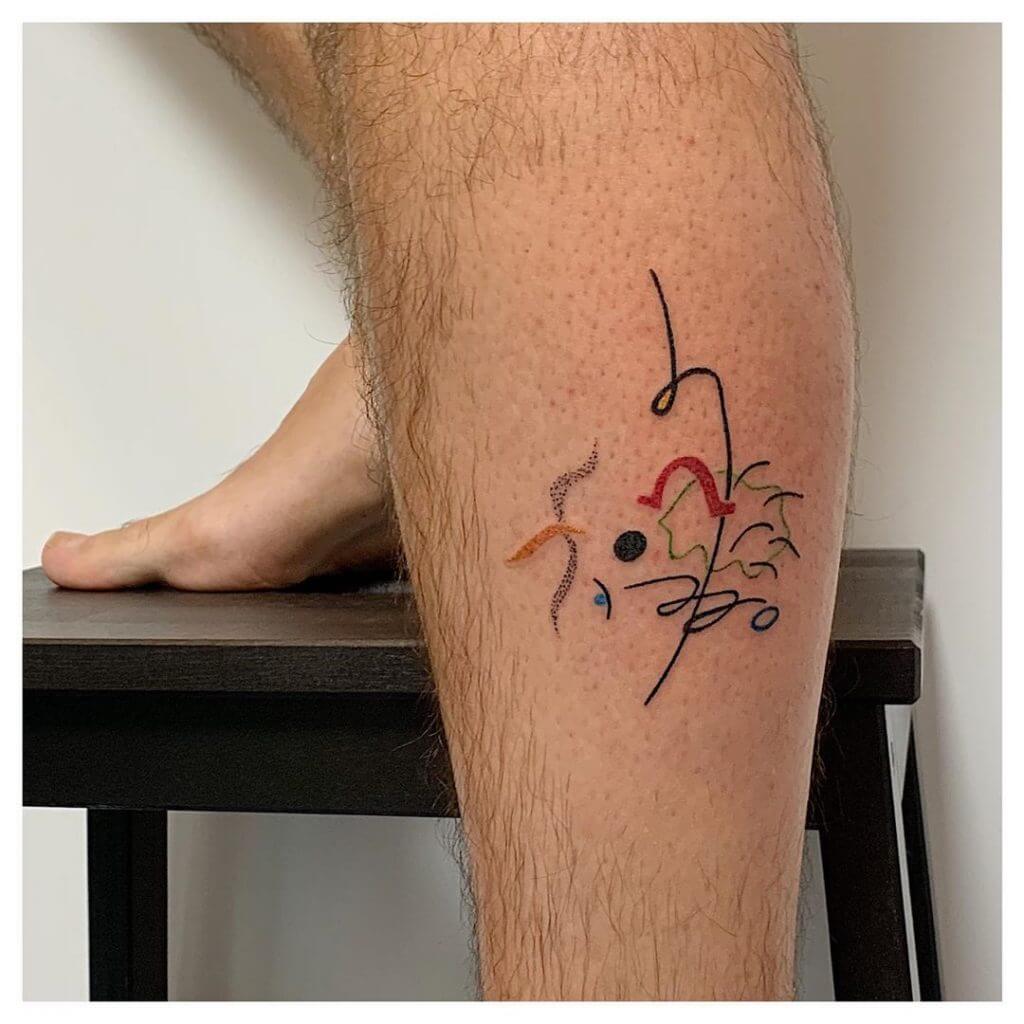Abstract tattoo on the left calf