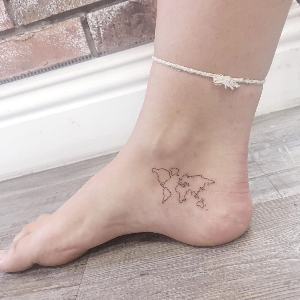 Small Black tattoo of an world map on the right foot