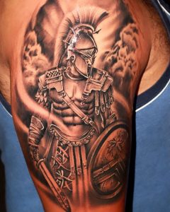 Black and Gray Tattoo of a male Warrior on the right shoulder