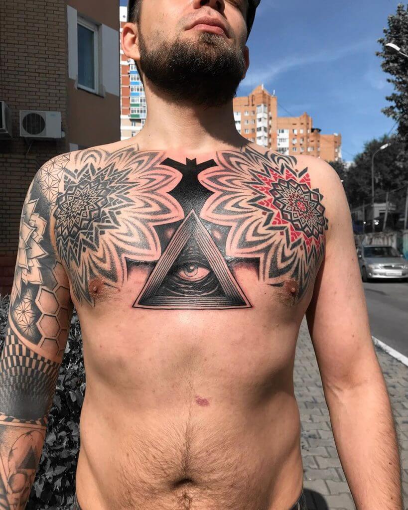 Mandala Male tattoo on the chest with an eye in the middle
