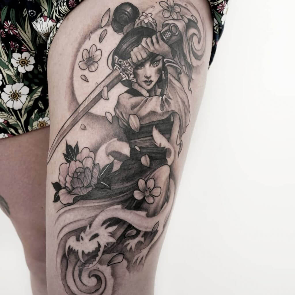 Black and Gray Tattoo of a female Warrior on the left thigh