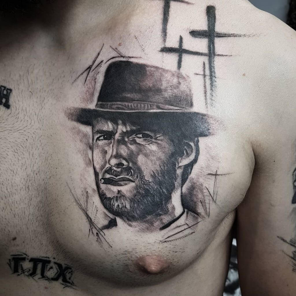 Black Male tattoo of Clint Eastwood on the left side of a chest