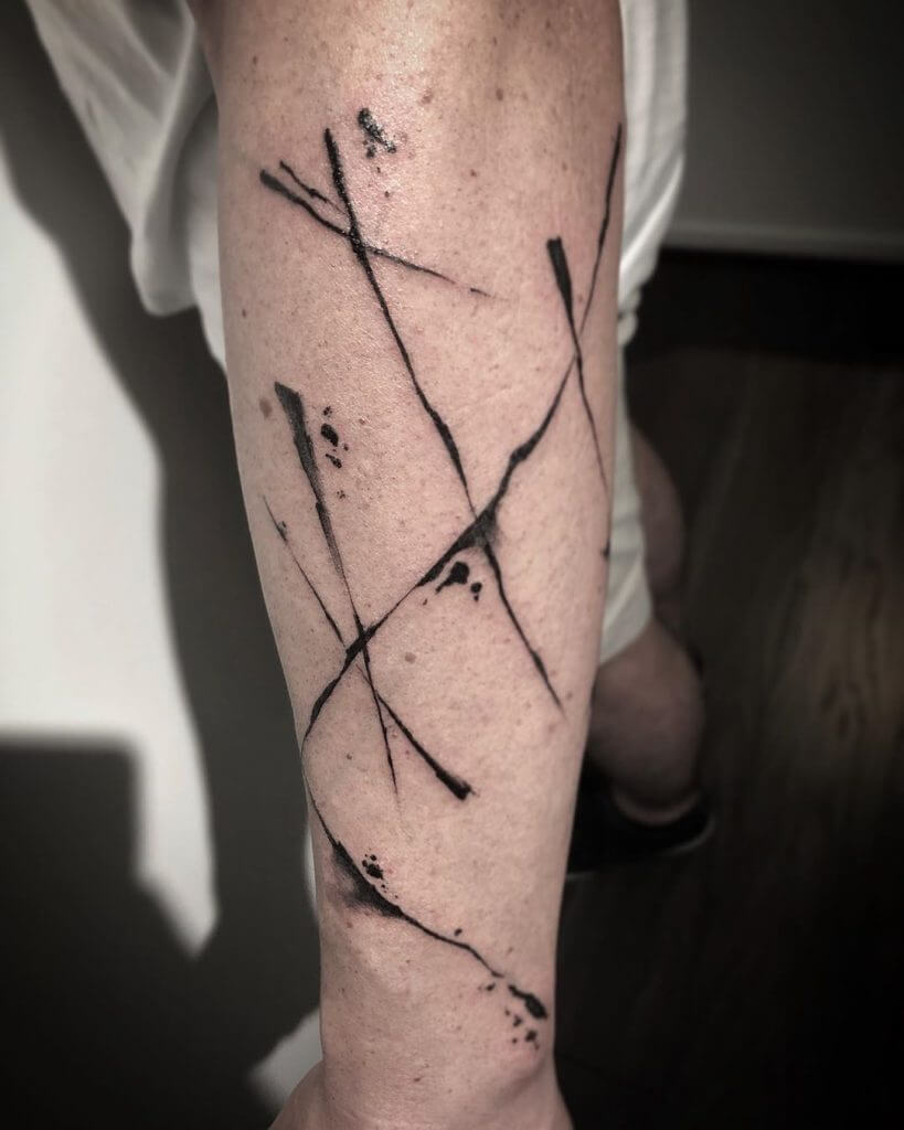 Abstract tattoo on the left forearm
