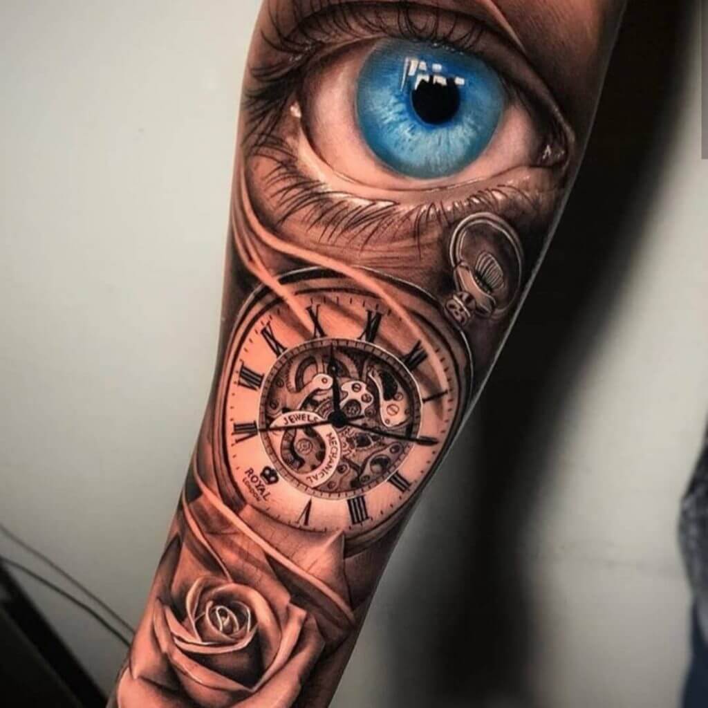 3D tattoo of an eye, a watch and a rose on the right forearm