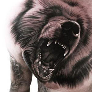3D Black tattoo of a bear head on the chest