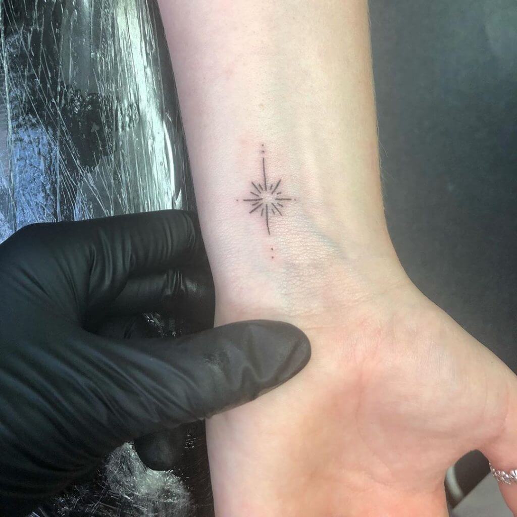 Small tattoo of on the left forearm