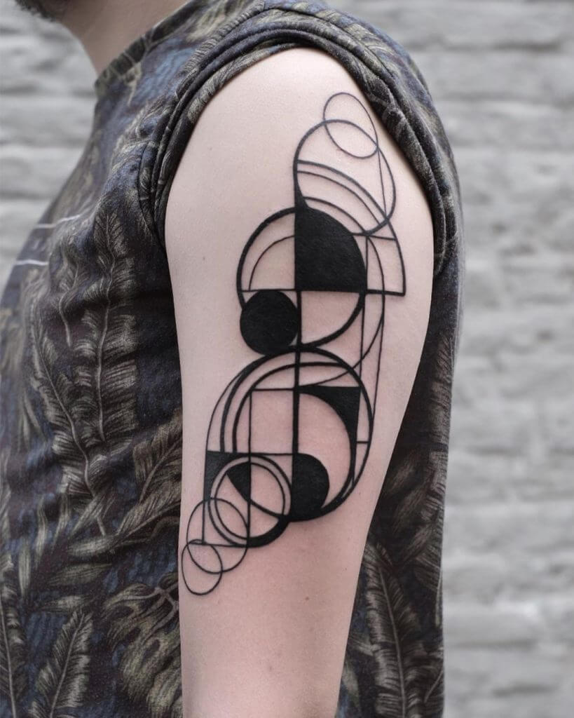 Abstract tattoo on the left shoulder