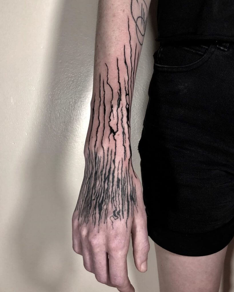 Abstract tattoo on the right forearm