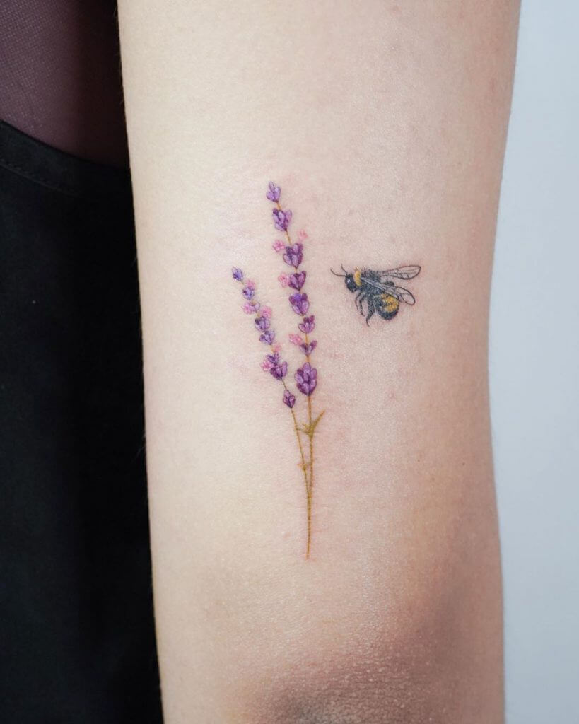 Color Female tattoo of a Lavender and a bee on the right arm