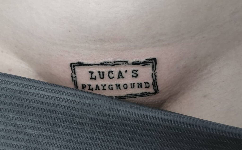 A letter tattoo right above the coochie