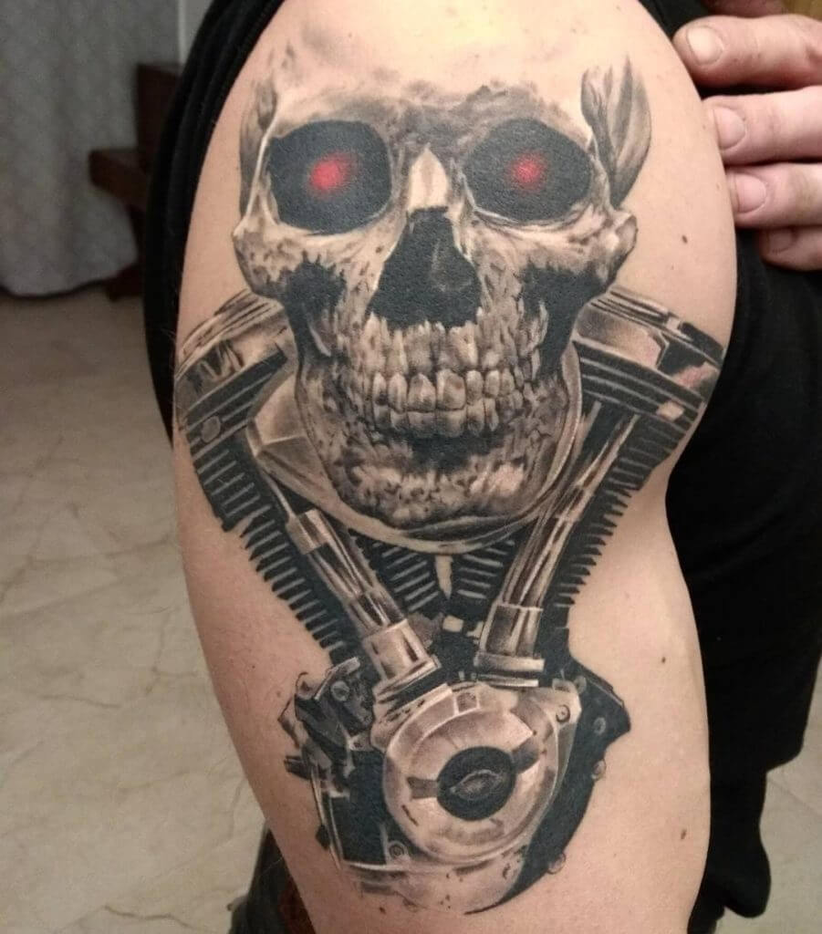 Mens motorbike tattoo of a skull and engine on the right shoulder