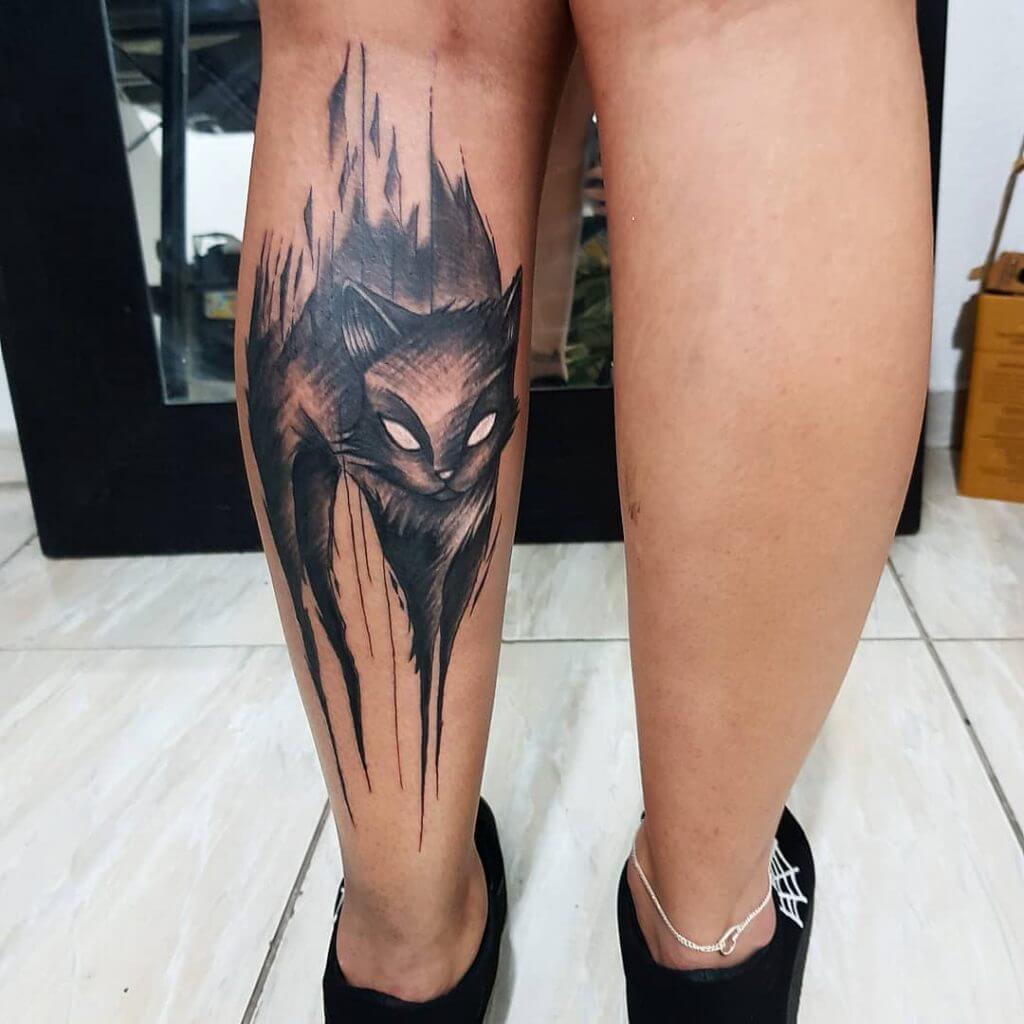 Black Animal tattoo of a cat on the left calf