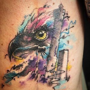 A watercolor tattoo of an eagle