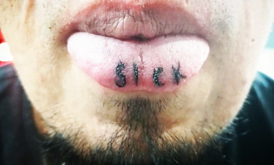 Letter tattoo on the tongue