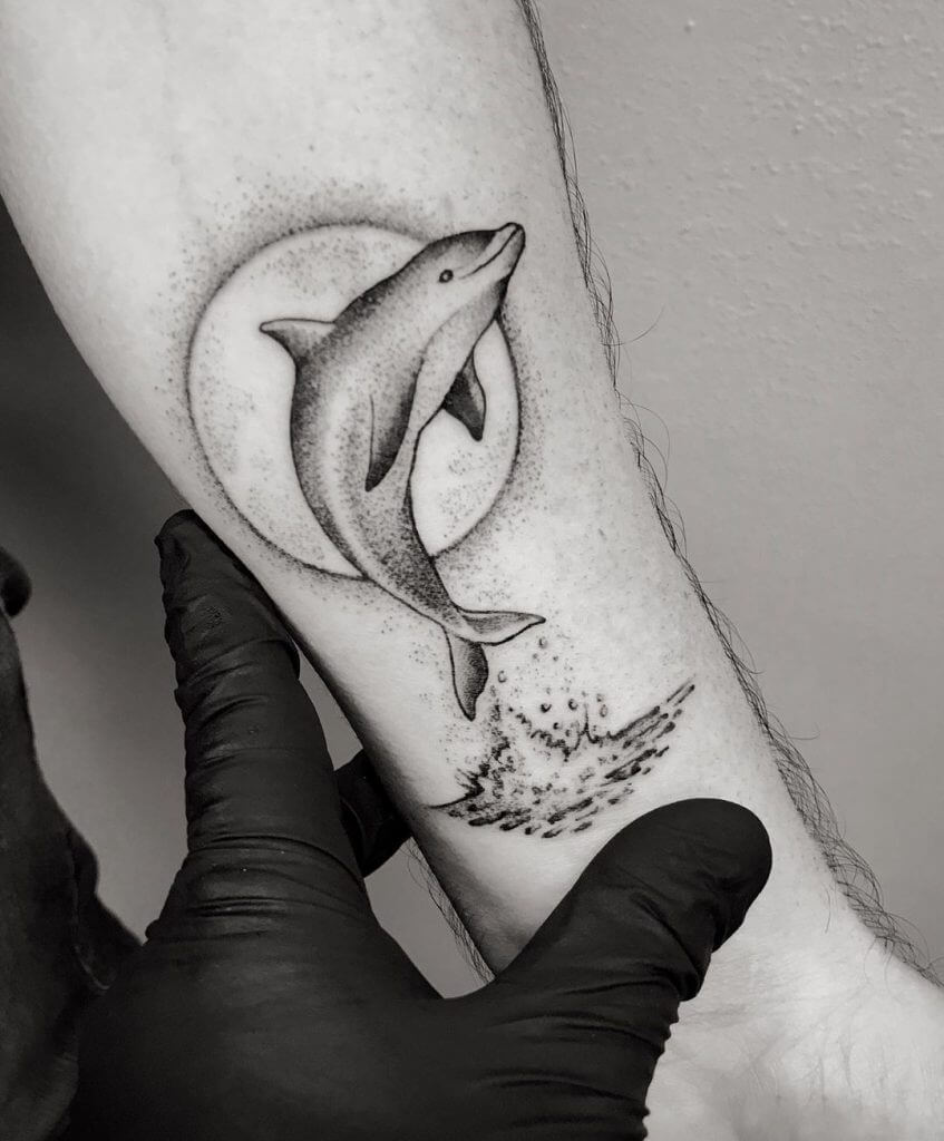 Ultimate meaning of the dolphin, sun and anchor tattoos