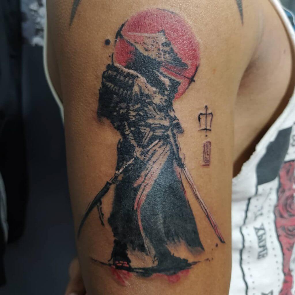 Samurai tattoo on the right arm