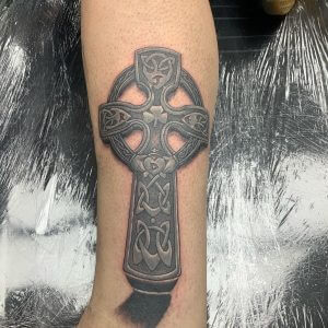 Celtic tattoo of a cross on the hand