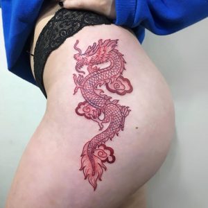 Red dragon tattoo for woman on the left side of the body