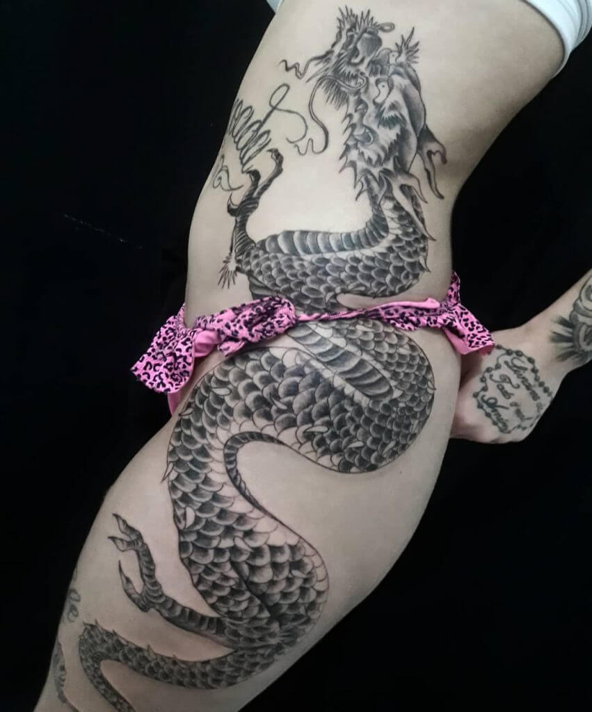 Black dragon tattoo for woman on the left side of the body