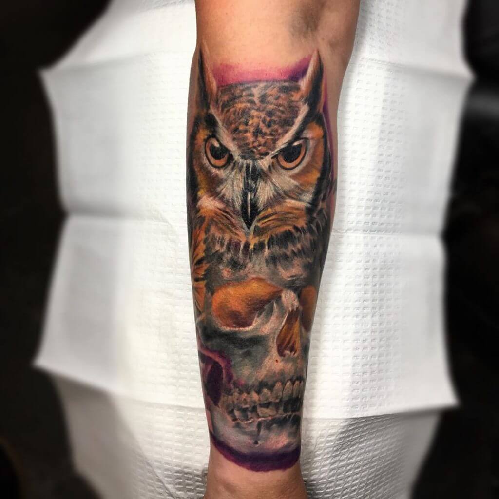 Color owl tattoo with a skull for men on the right forearm