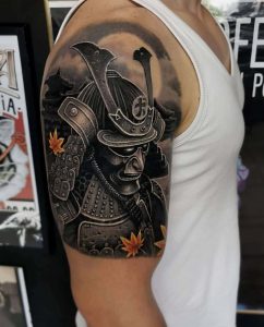 Samurai mask tattoo on the arm