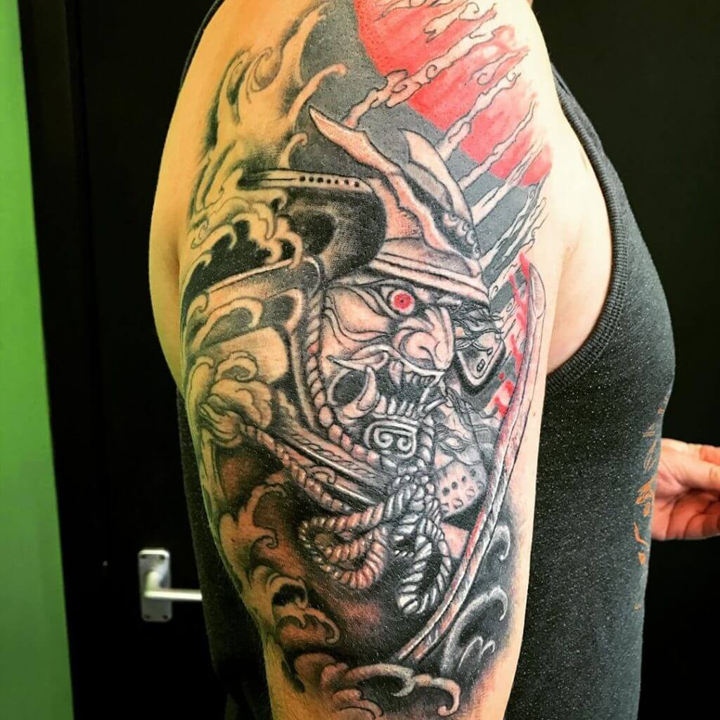 Samurai mask tattoo on the arm