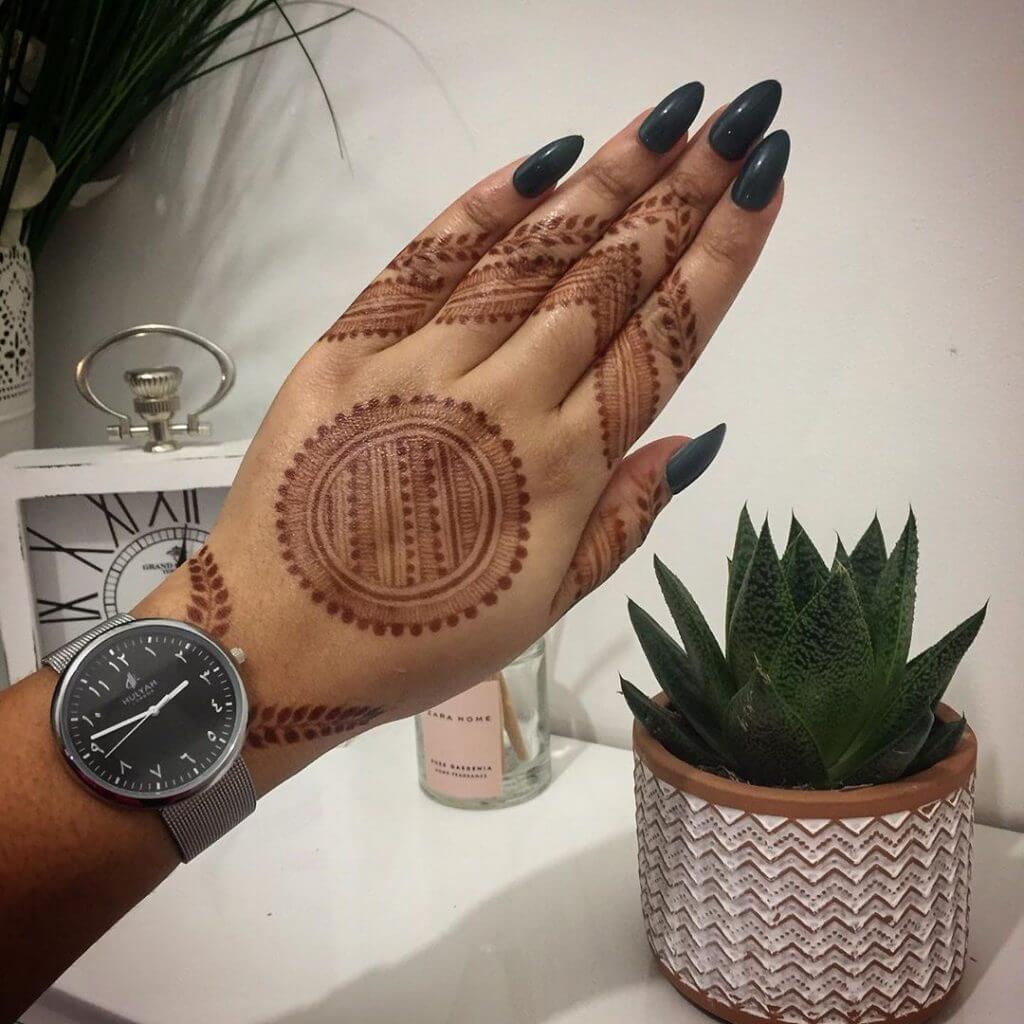 Temporary henna tattoo on the hand