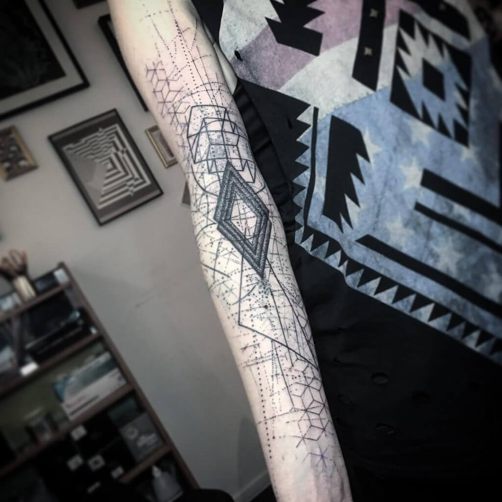 Abstract geometric tattoo on the right arm