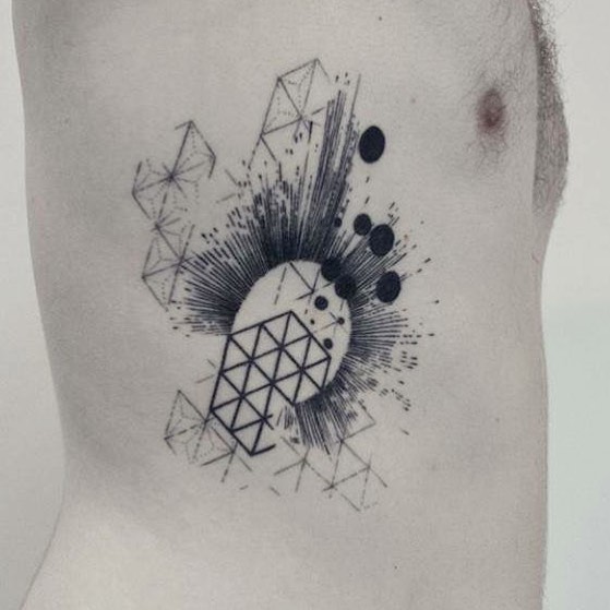 Abstract geometric tattoo on the ribs