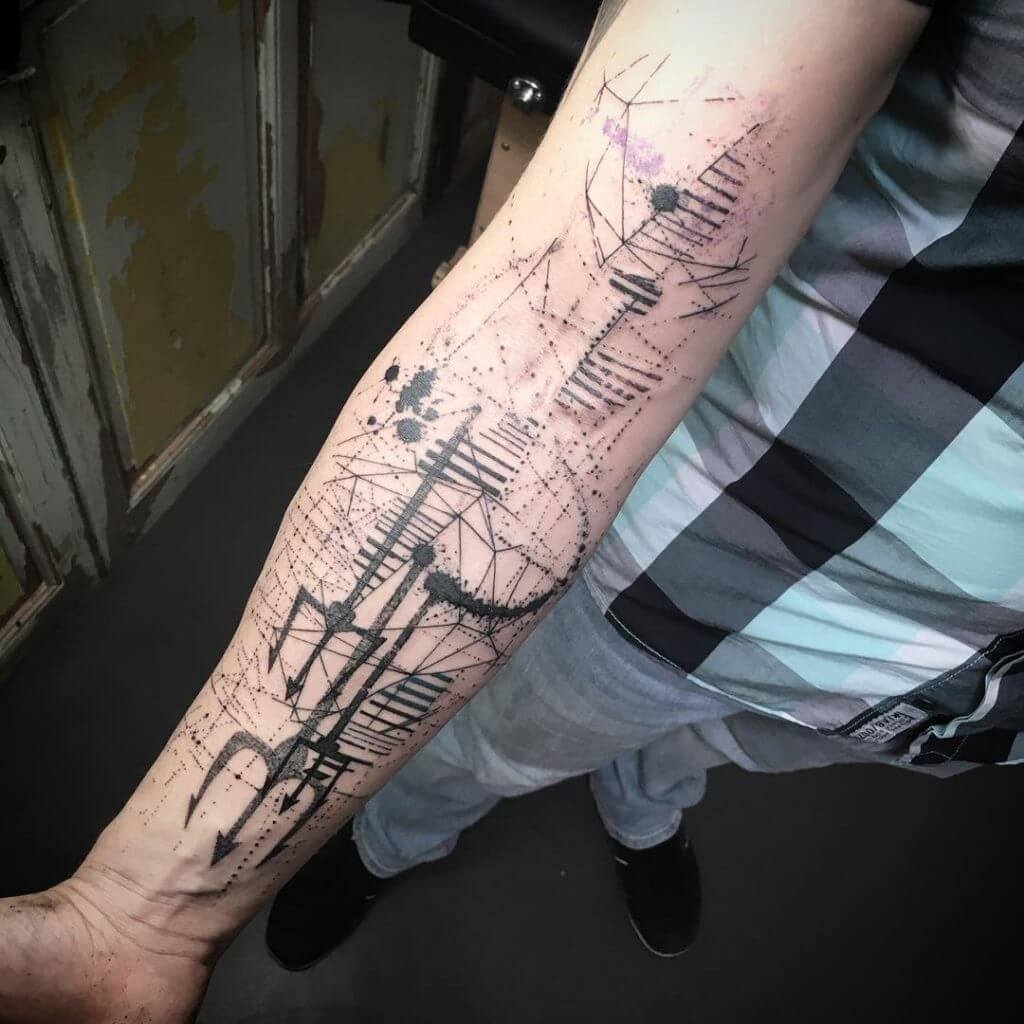 Abstract geometric tattoo on the right forearm