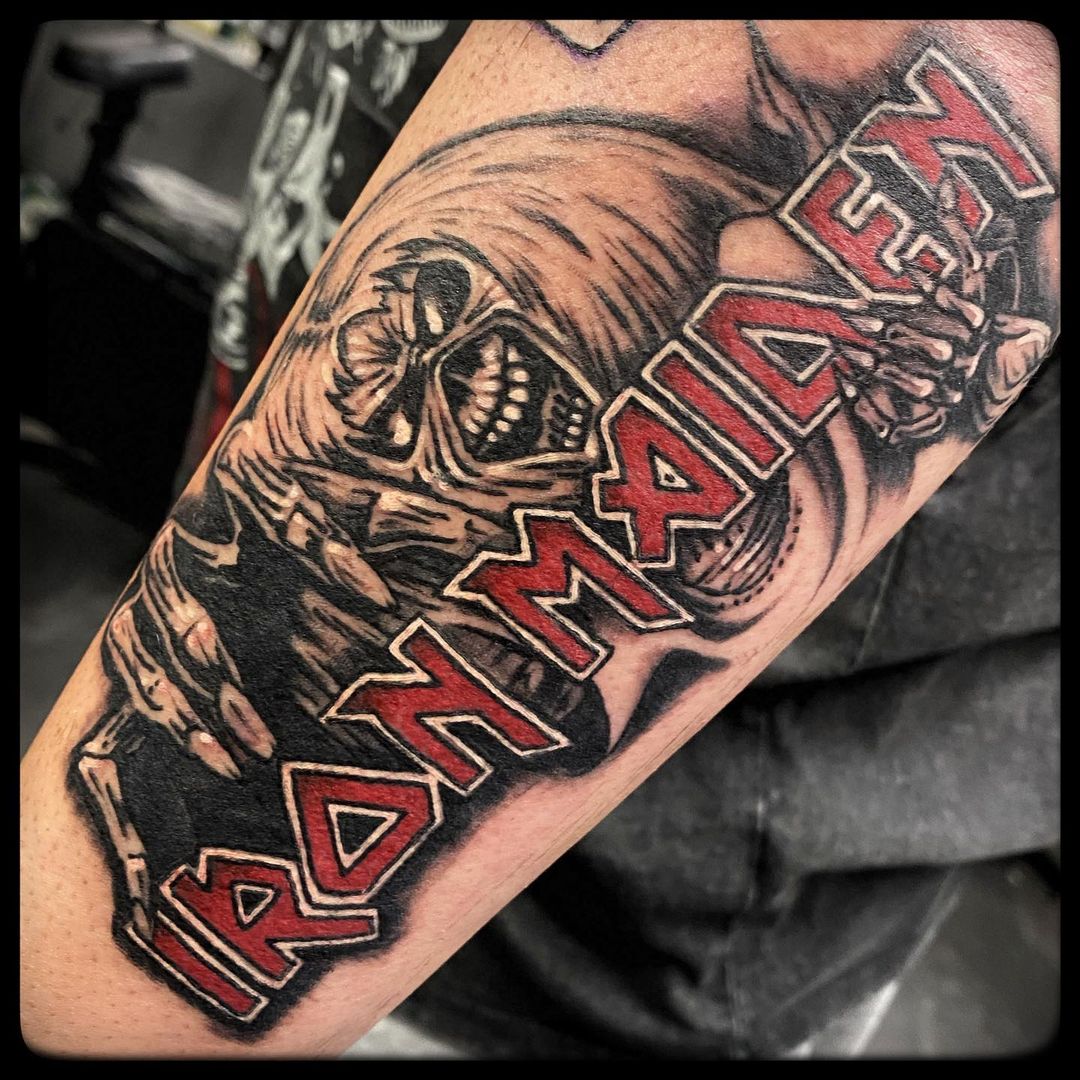 Iron Maiden tattoo located on the upper arm