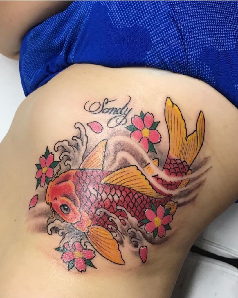 Koi fish tattoo on the ribs