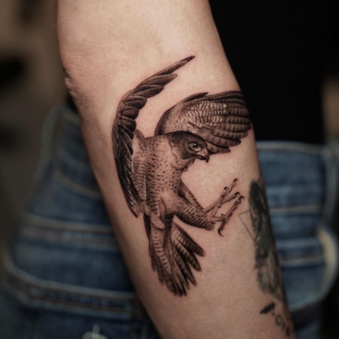 Fine line Millenium Falcon tattoo on the inner forearm