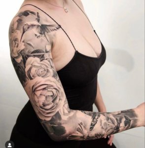 Impressive whole arm tattoos for women 3