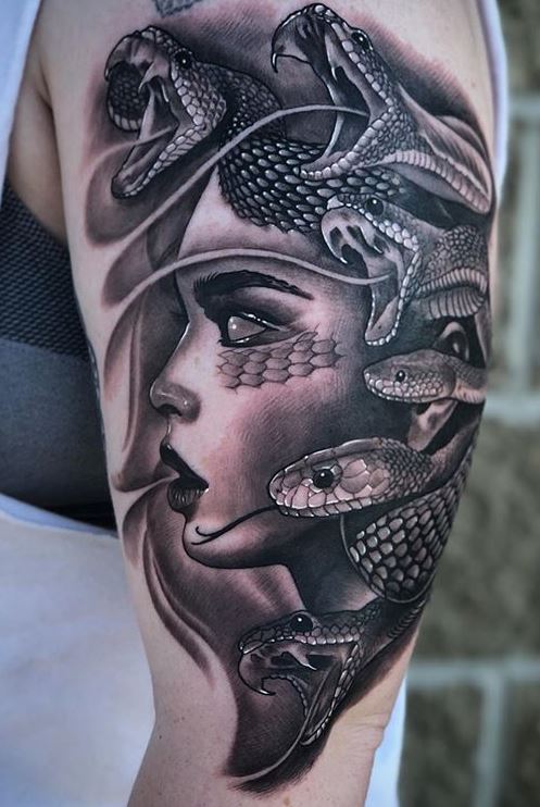 Black and gray Medusa tattoo on arm