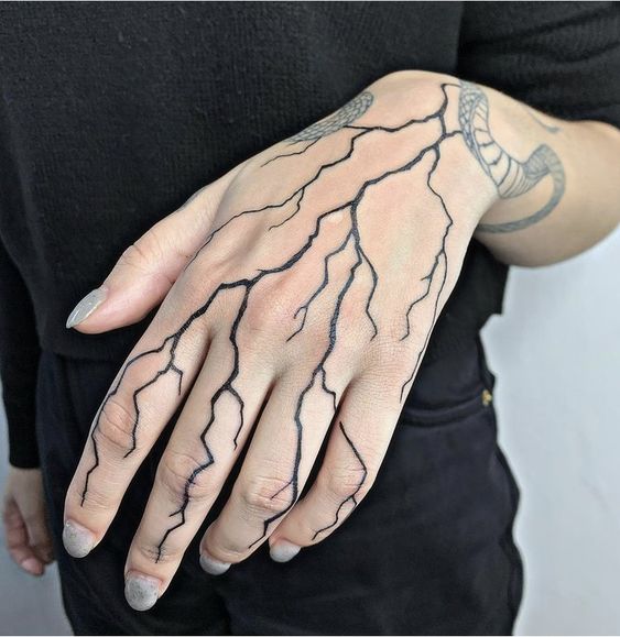 Minimalist lightning bolt tattoo in white ink healed