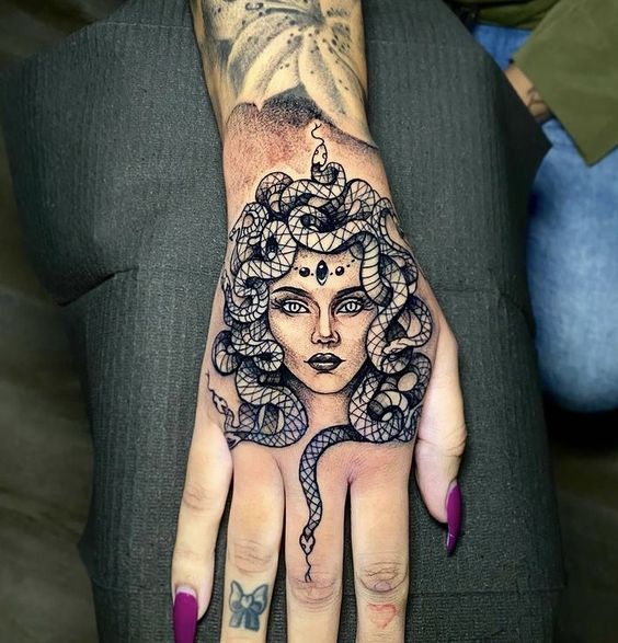 Medusa tattoo on hand for men and women