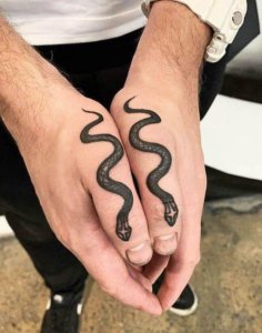 Keep it simple and get a simple snake tattoo 4