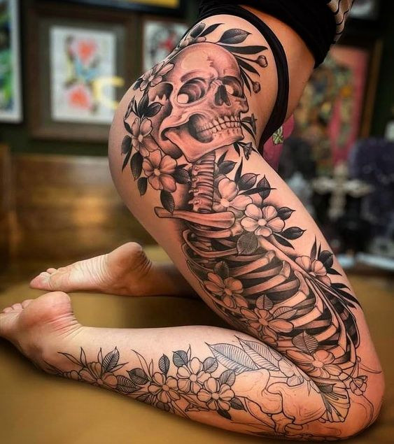 Black Polynesian Design With Three Flowers Tattoo On Girl Full Leg