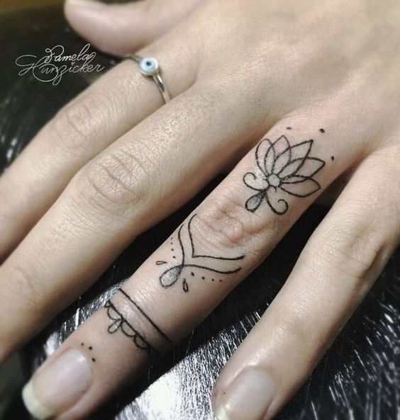 10 awsome ideas of lotus tattoo for your fingers
