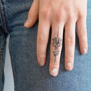 10 awsome ideas of lotus tattoo for your fingers 7