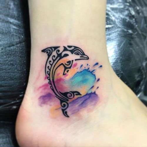 Ankle is a perfect place for cute dolphin tattoo