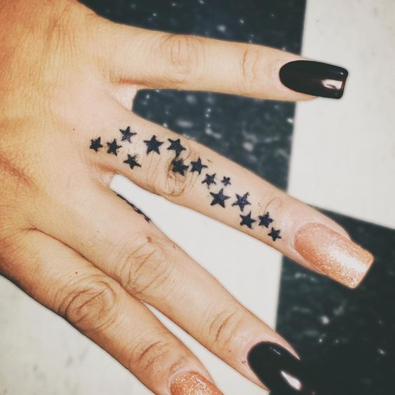 Colorfull or simple black stars tattoo for your hand